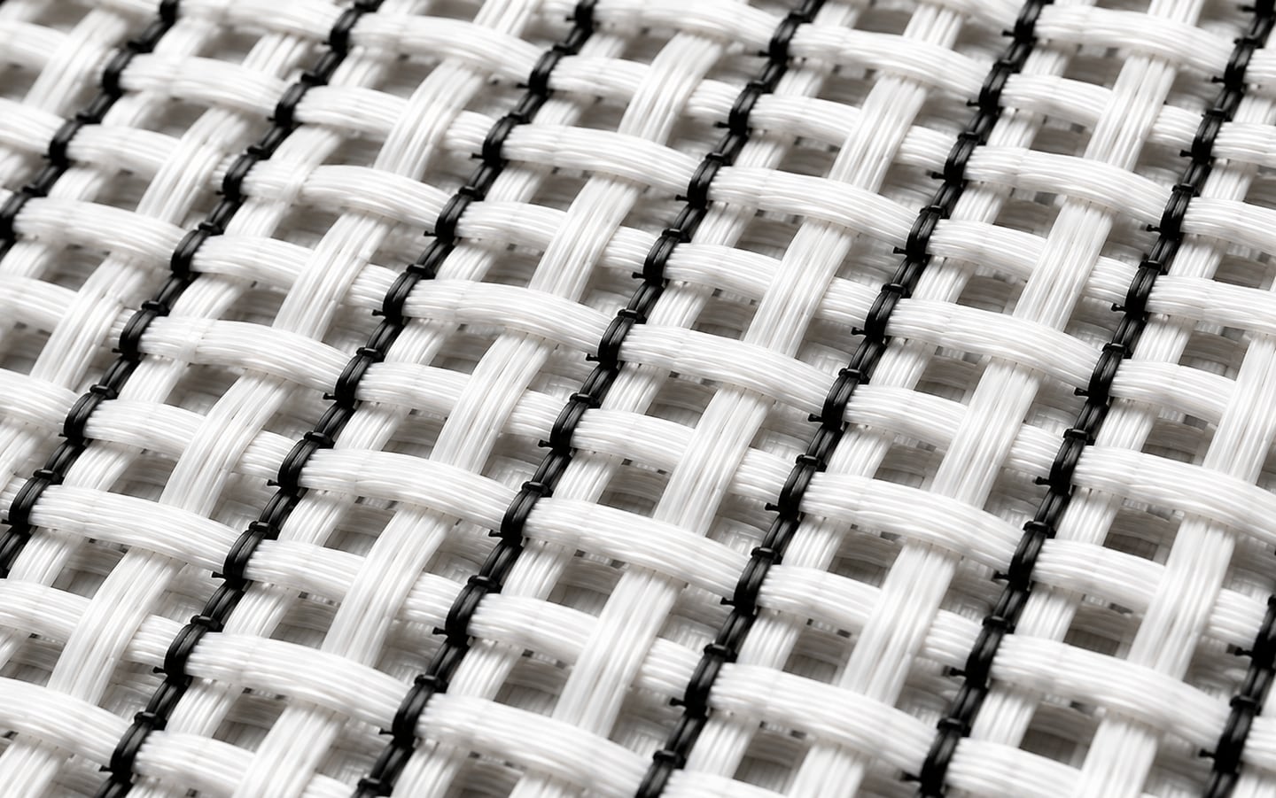Antistatic woven filtration fabric, conductive black yarns woven through the white base at regular intervals