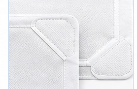 Non-woven wear patches and edge reinforcement