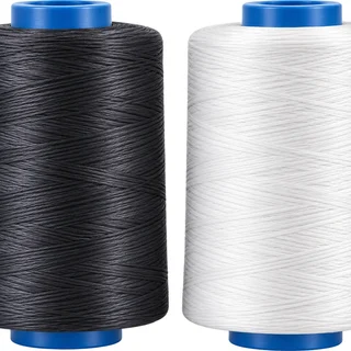 Yarn cones in black and white awaiting production