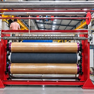 Calendering line at DFR, fabric running over the heated rollers
