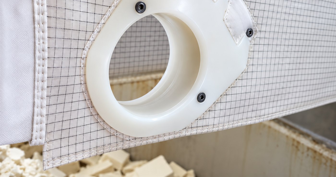 DFR filter press cloth from an edible oil duty, barrel feed neck and backing mesh, with spent bleaching earth cake below